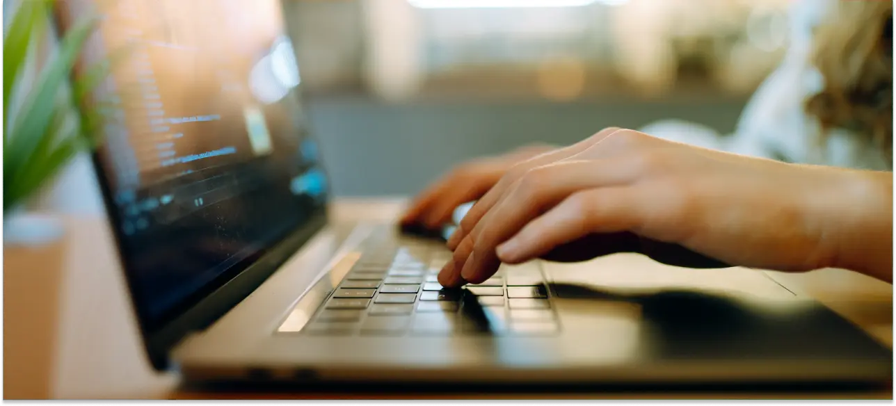 Hands typing on a laptop keyboard_ Siemens-Gamesa_Reference-Story